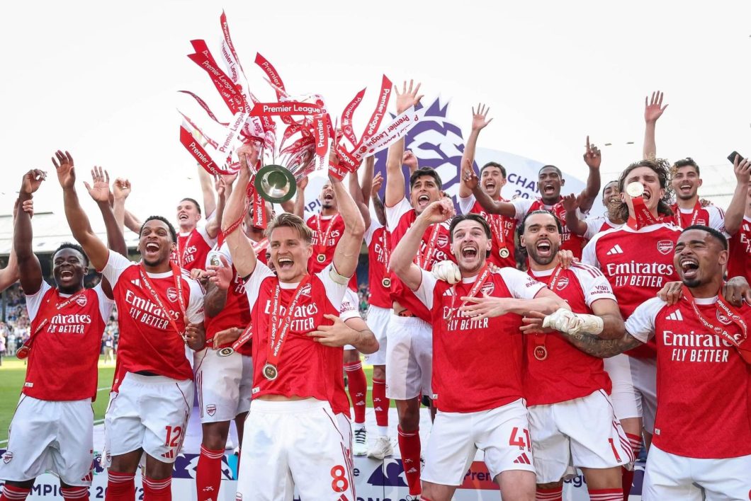 Arsenal squad celebrating with their Premier League trophy 2025/2026